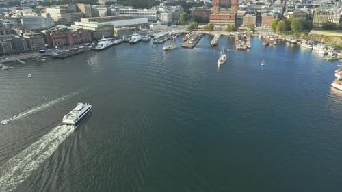 Large boats move in and out of the marina of Pipervika in Oslo Norway