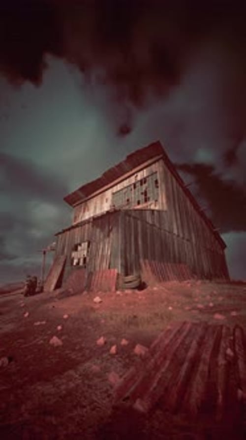 Barn Standing in Field Under Cloudy Sky