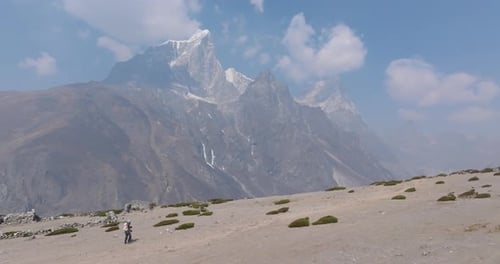 Female Trekker Climbing in Khumbu Mt Cholatse Backdrop & Dreamy Everest Trek