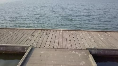 Fly over the dock harbor drne footage