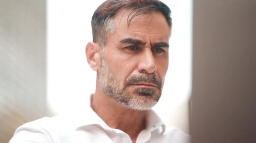 Clouse-up, mature businessman user on laptop pc computer sit at cafe outdoors