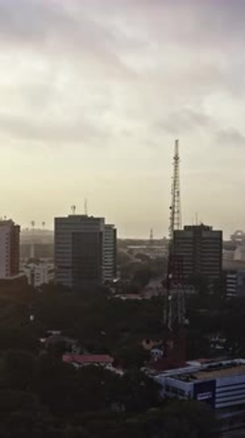 Aerial view of Accra showing urban skyline and communication towers