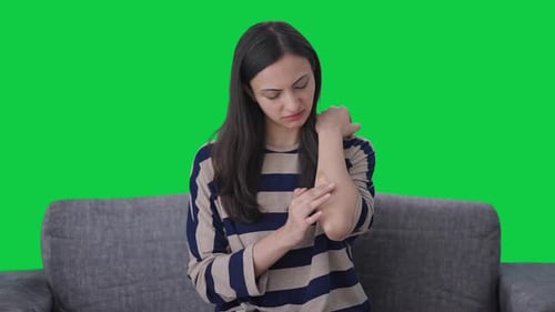 Ill Indian girl applying a bandage Green screen