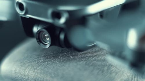 Drone Camera Lens on a stabilizer, propellers and sensors, hyper close up, aerial photography gear,
