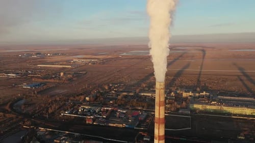 Aerial View of Thermal Power Plant Drone Flies Over Chimney Smoke Pipes and Cooling Towers of