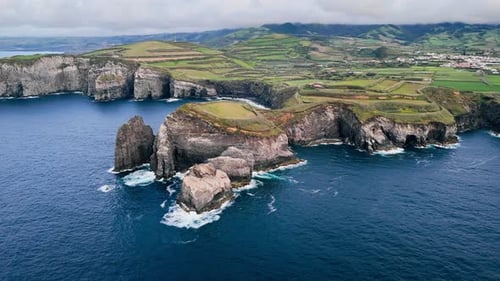Dark Blue Atlantic Water Meeting Basalt Cliffs on Sao Miguel Island Azores