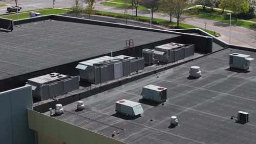 Big Industrial HVAC Air Conditioner System on the Roof Wide Aerial View