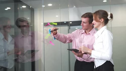 Team brainstorming session in modern office with creative discussion and collaborative ideas