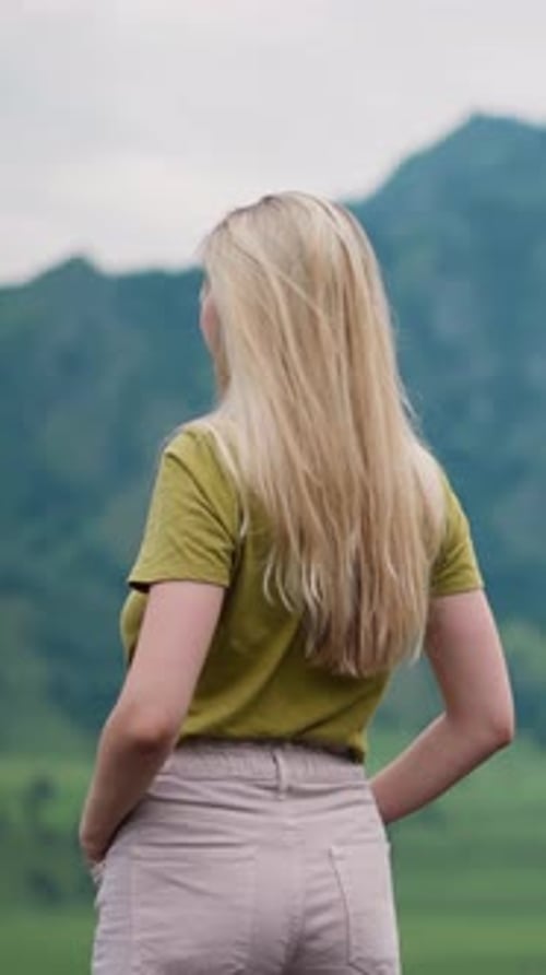 Woman Enjoys the Mountain View on Sunny Day