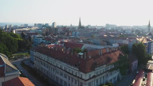 Novi Sad city roofs and church in fog