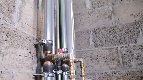 Pipes Connected to Wall with Valves