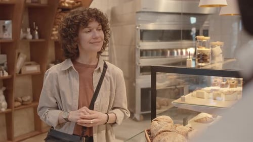 Female Customer Making Order at Bakery
