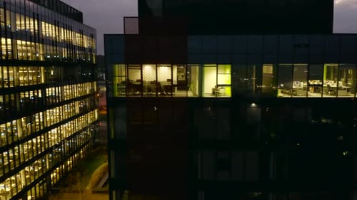 Drone Captures LateNight Office Activity in a Glass Skyscraper