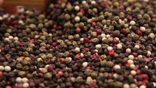 Colorful pepper mix with wooden spoon