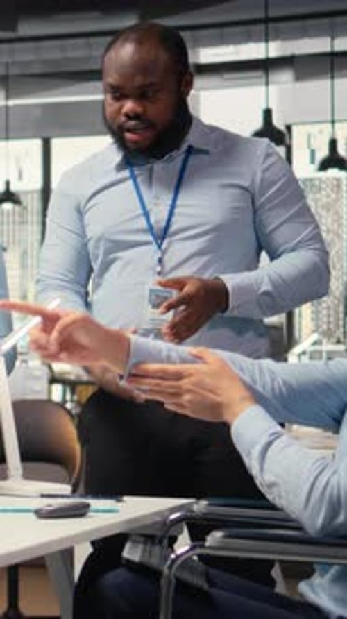 Vertical Video Happy Worker with Paraplegia and Prop Firm Colleague Doing High Five