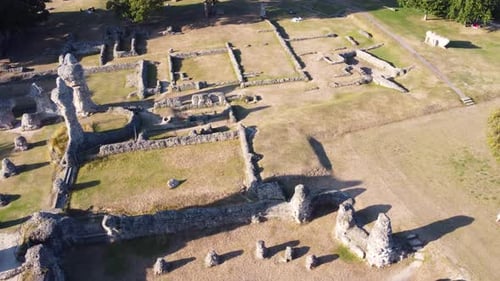 Bury stone of St Edmundsbury Cathedral in sunlight - aerial drone track shot