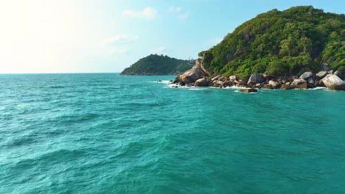Sea waves breaking over rocks. Amazing tropical sea wave.