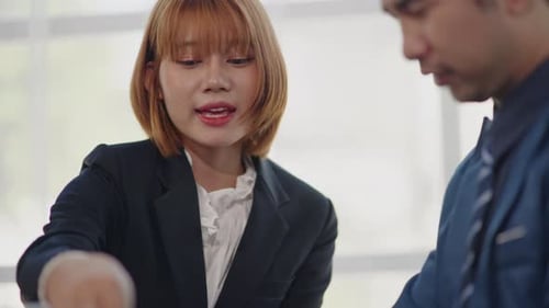 Business Professionals Collaborating in Office Workplace Setting