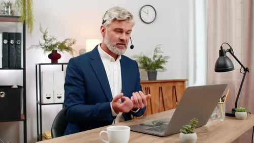 Man in Suit Speaks During Video Conference Call