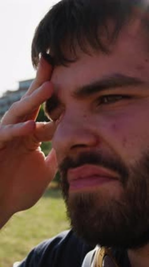 Sleepy Boy Wakes Up After A Nap On A Park Bench