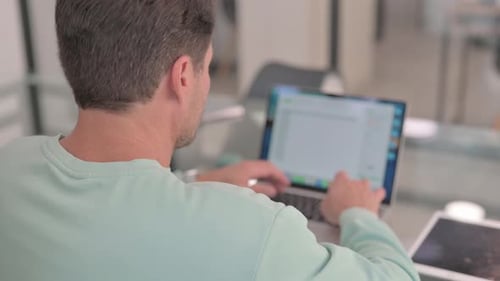 Close up of Man Typing on Laptop