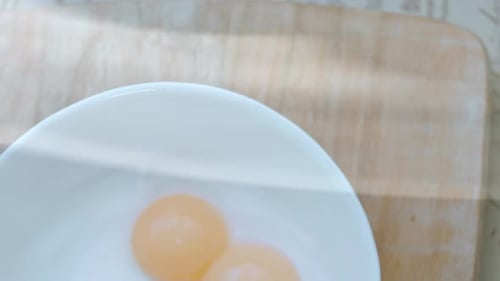 Egg Yolks in a White Bowl