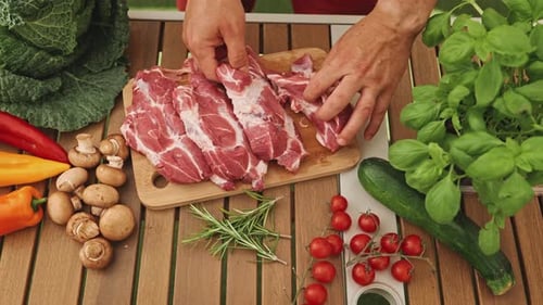 The Chef Carefully Selects the Delicious Raw Steak for the Grill
