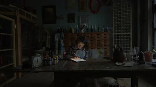 Woman Using Tablet Computer at Night Female Graphic Designer Using Tablet for Work