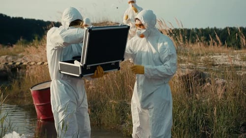 Scientists in Hazmat Suits Examine Environment