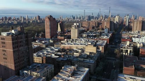 Crisp aerial stationary shot with Harlem NYC rooftops with the Upper East and West sides and Midtown