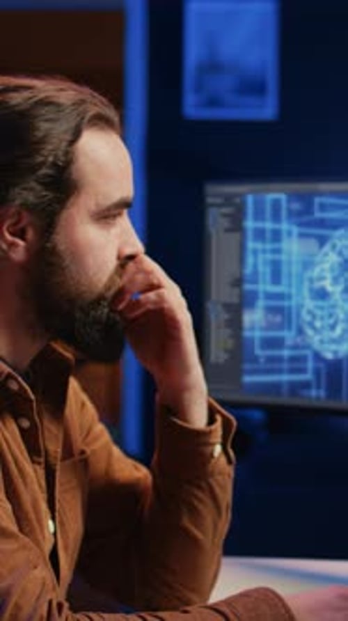 Adult Man Typing at Computer Late at Night