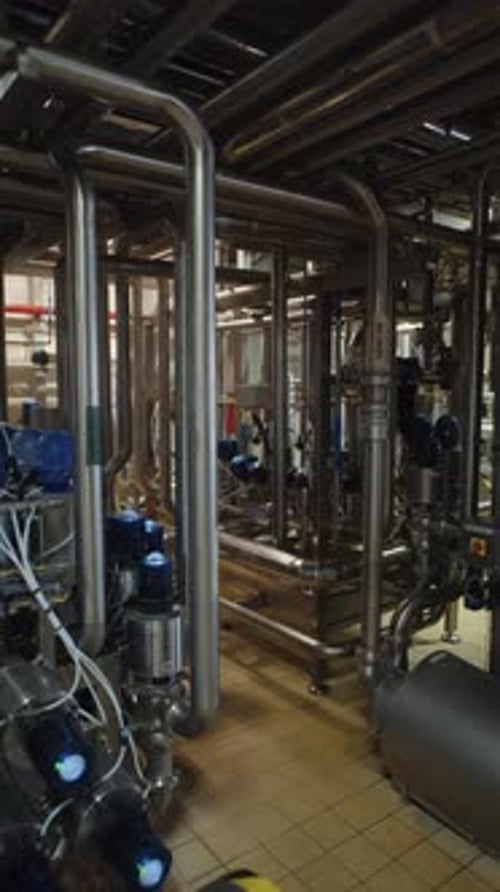 Industrial Stainless Steel Piping System in Production Facility