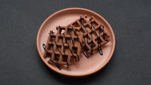 Chocolate Waffles Drizzled with Chocolate Syrup on Plate