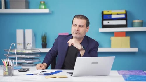 Thinking Man at Desk in Bright Blue Office