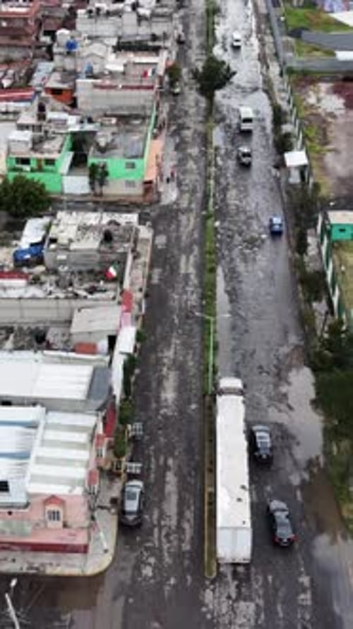 Drone explores Ecatepec’s bumpy paths. Vertical shot