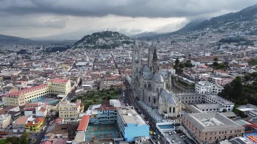 Aerial View of a Cityscape Under a Cloudy Sky