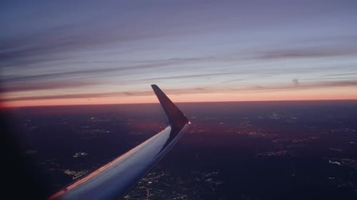 Airplane flying over city