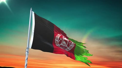 Tattered Afghanistan Flag Waving Against Dramatic Sunset Sky