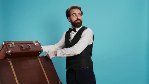 Bellboy Carries Trolley Bags in Studio