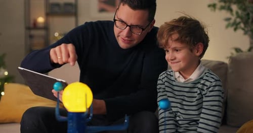 Father and Son Learn About Solar System Together