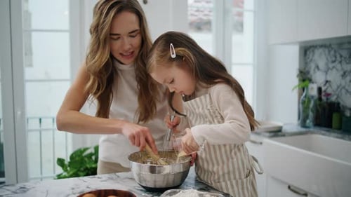 Caring Woman Talking Child at Kitchen Close Up. Positive Family Creating Dough