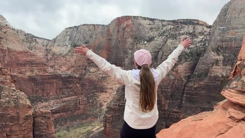 A Woman Enjoys a Vacation at the Canyon of Zion