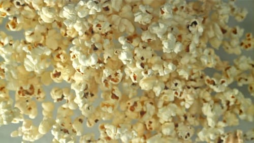 Popcorn Flies Up and Falls Down On a Light Background Filmed on a Highspeed Camera at 1000 Fps