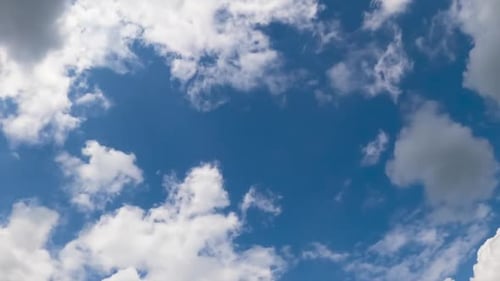 Clouds Drifting Across Blue Sky in Time Lapse
