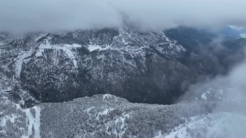 Snowy Mountains Aerial View on a Cloudy Day