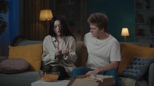 Loving Couple Embrace After Positive Pregnancy Test