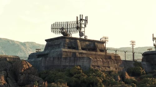 A Military Base with a Rock Structure and a Satellite Dish on Top