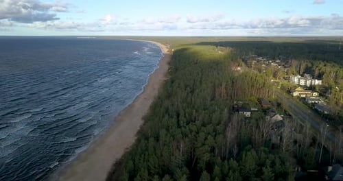 Aerial shot of a small seaside city Saulkrasti and a beautiful beach in Latvia.