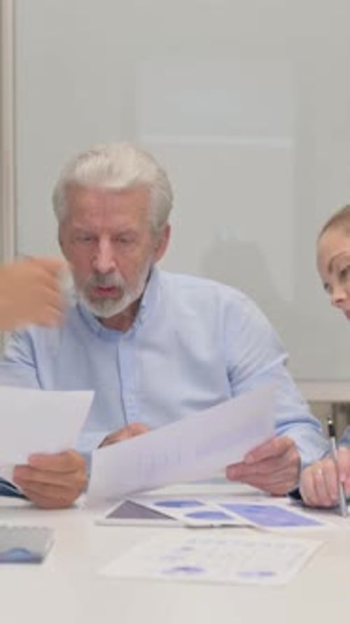 Close up of Business People Working on Documents, vertical video