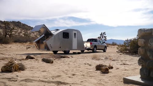 Truck and Camper in Desert Landscape